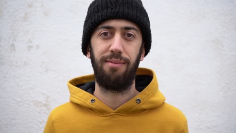 Young Caucasian Man Smiling With Finger Pointing To Nose