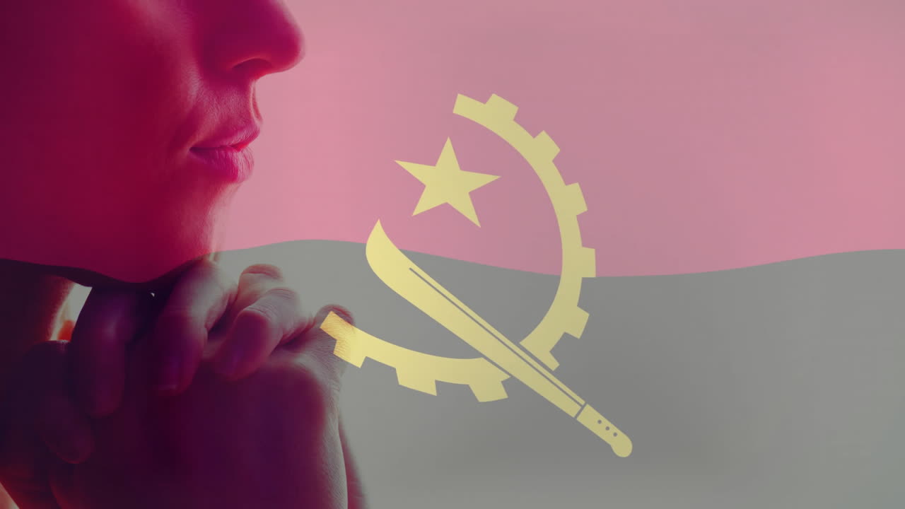 Contemplating Angola flag with emblem, person thinking deeply about national pride