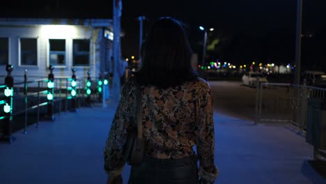 Woman-walking-on-night