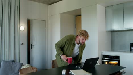 man working from home in a modern kitchen