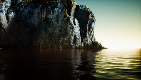 rocky cliff at cold sea water