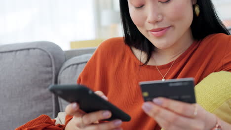 Credit-card,-ecommerce-and-asian-woman-on-sofa