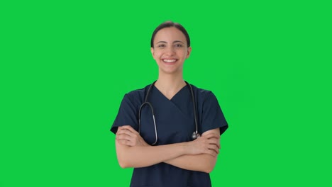 Portrait-of-Happy-Indian-female-doctor-in-scrub-suit-Green-screen