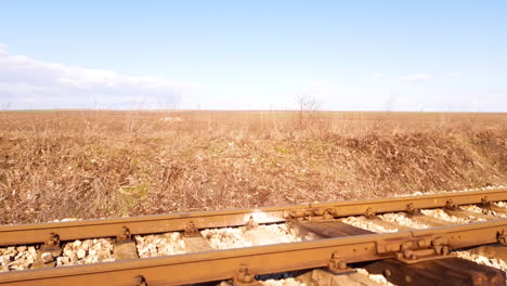 empty railroad in the countryside on hot sunny day