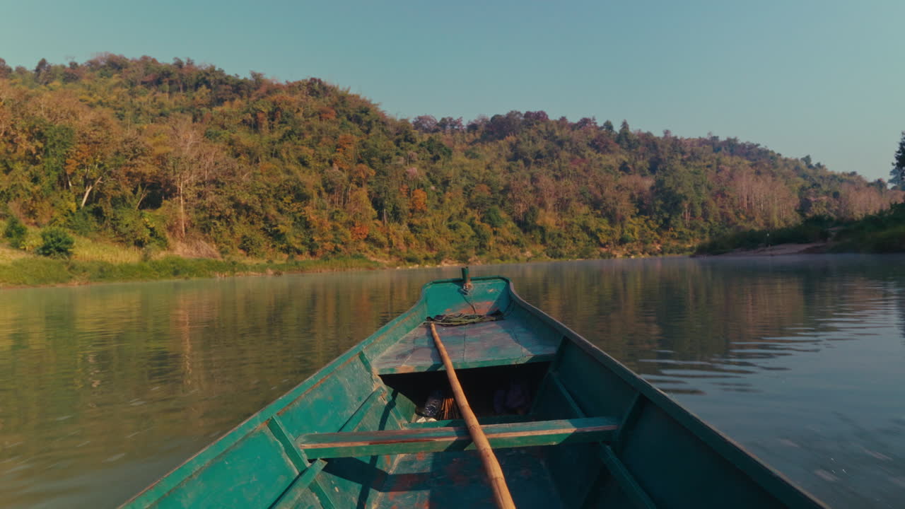 A tranquil boat trip on a river through a lush forest