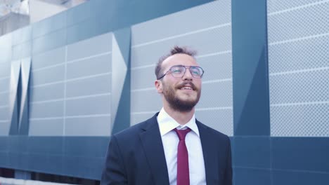 Businessman-walks-by-laughing.