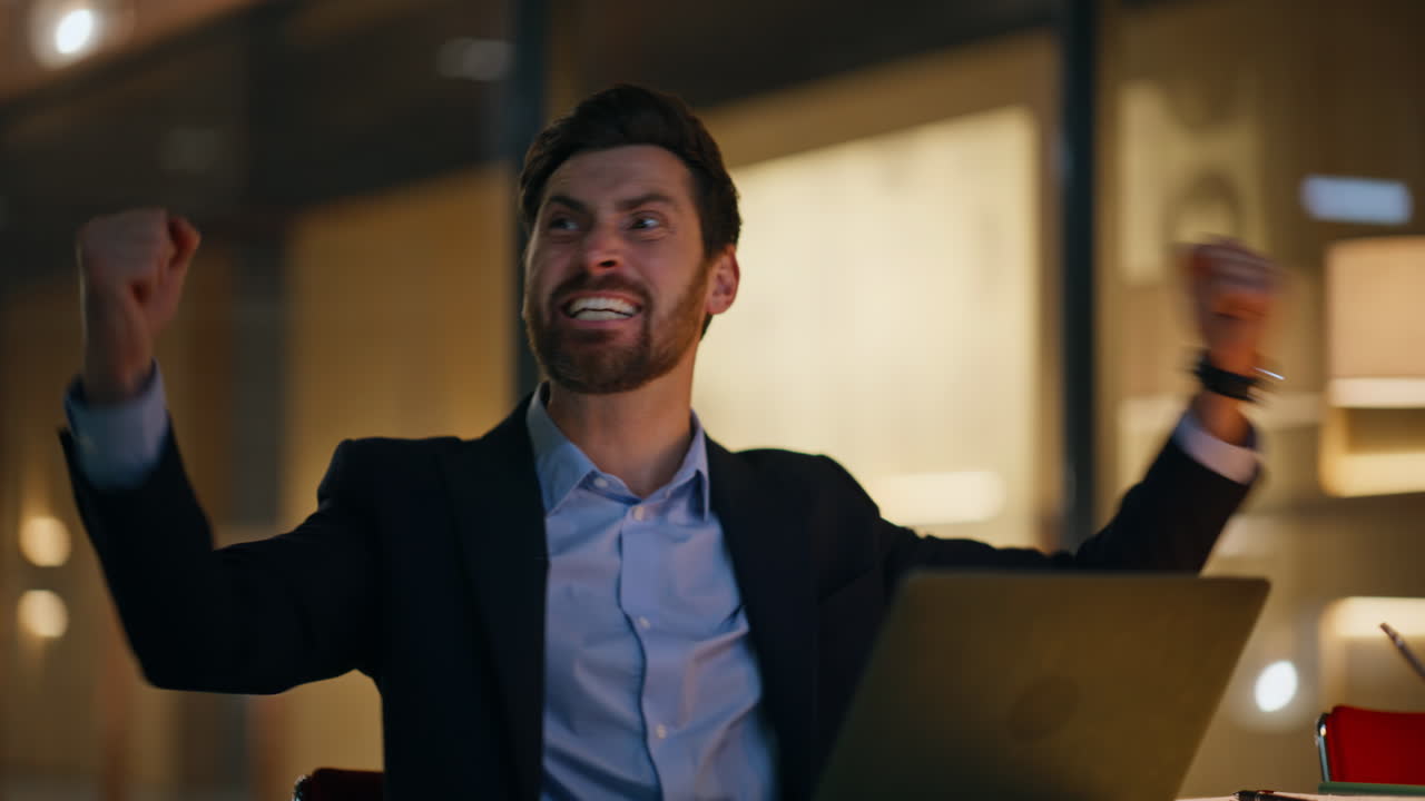 Surprised freelancer rejoicing success receiving great news at office closeup