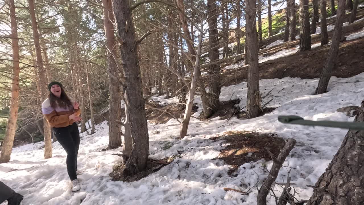 Friends Enjoying a Snowy Day in the Forest