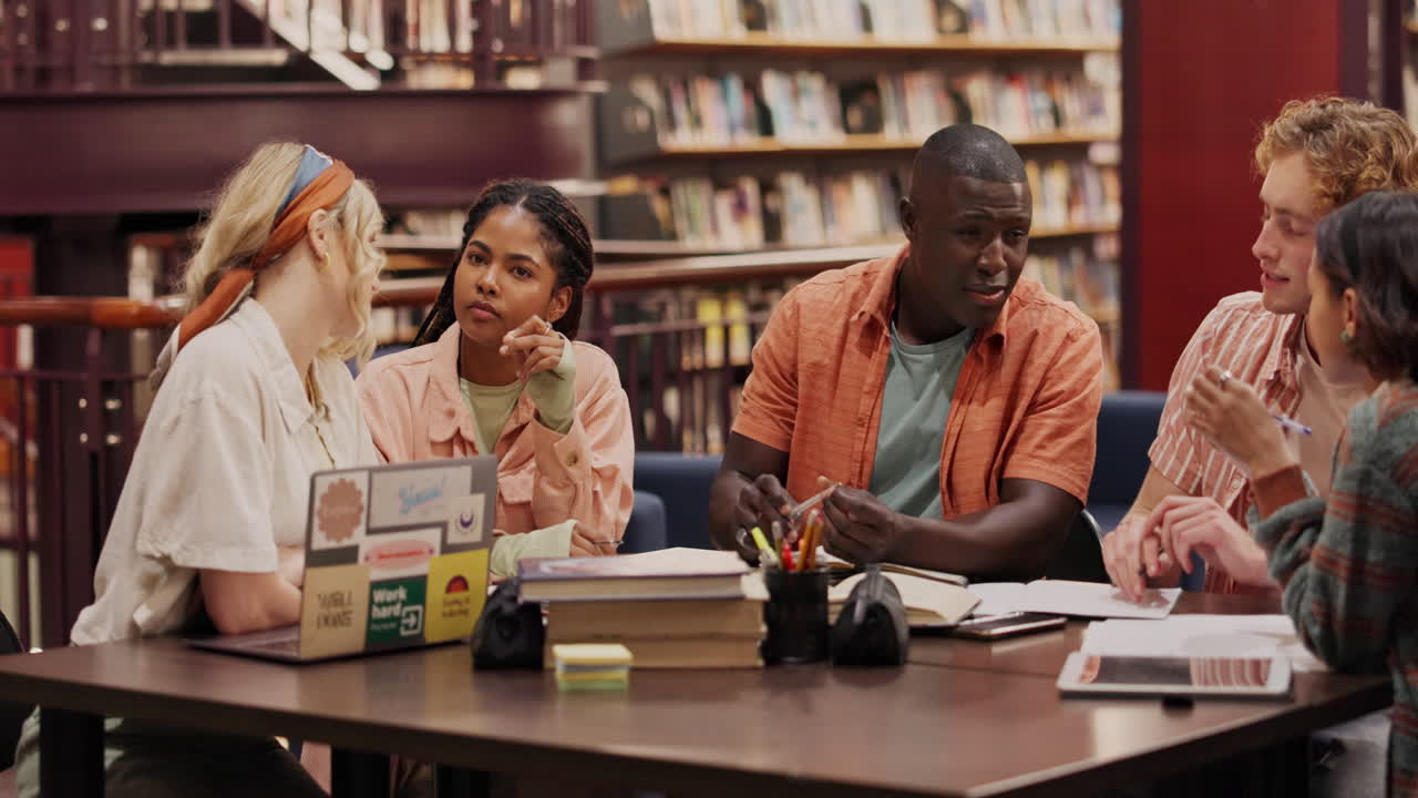 Group of students studying together in a library