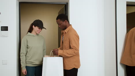 man receiving food delivery