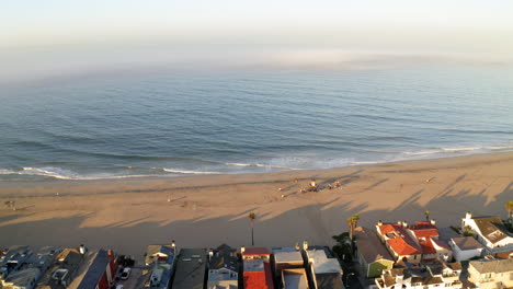 aerial view of a coastal beach town at sunrise