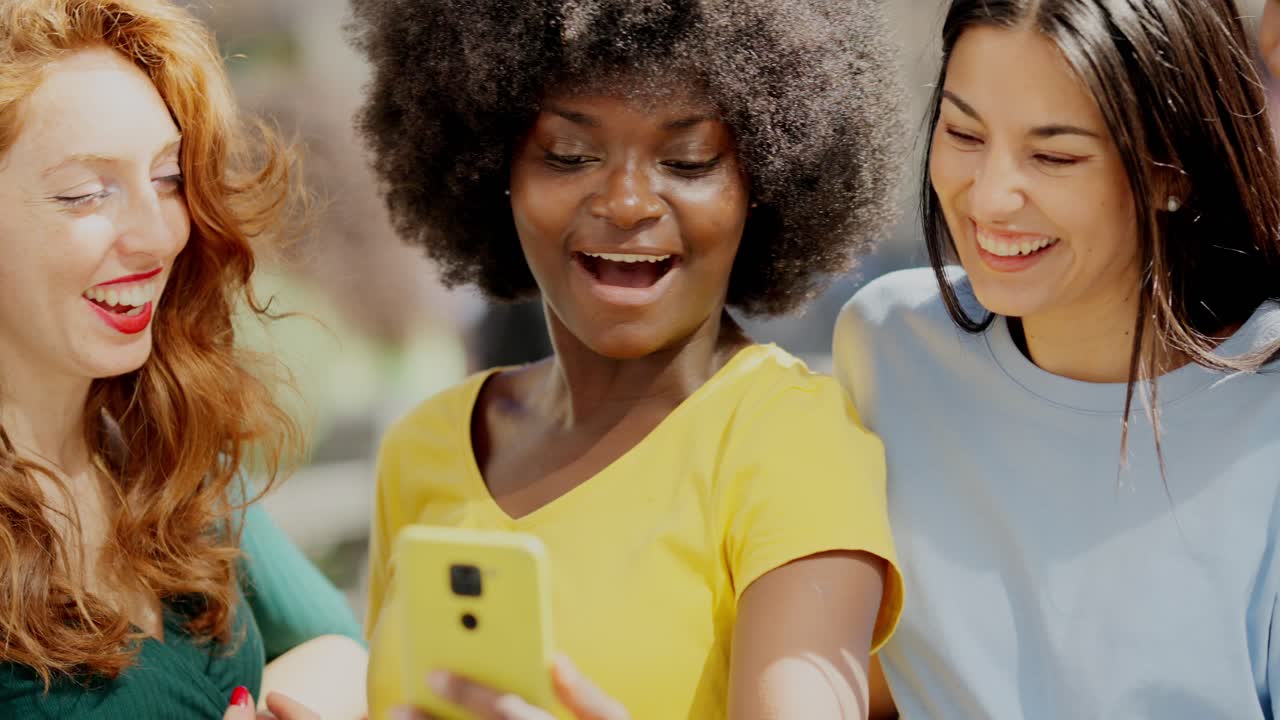 Diverse Friends Sharing a Joyful Moment with a Smartphone