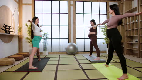 women doing yoga indoors