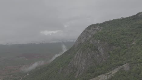 drone shot of a cloudy misty mountain in kenya taita hills