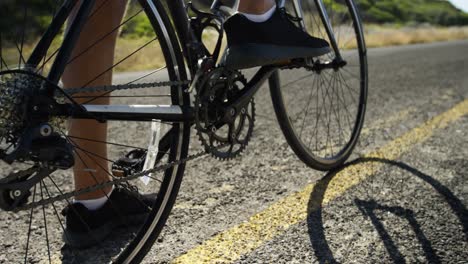 triathlete man getting ready to ride a cycle