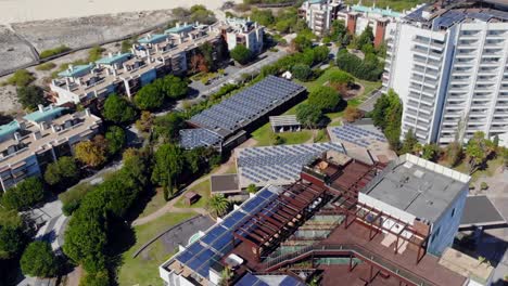 Drone-shot-of-the-roof-top-on-a-hotel-building-in-Troia,-Portugal