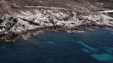 Aerial-Drone-Mykonos-Greece-Blue-Water-Pan-Down