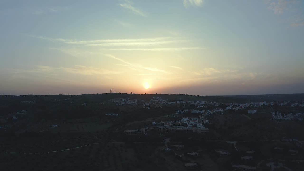 Flying Above Mountain River Toward Small Town