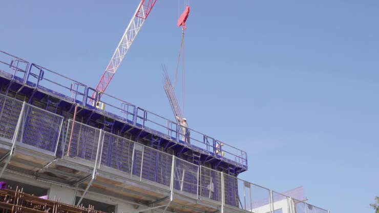 Construction worker holding some steel with a crane. Montpellier France day time