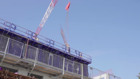 Construction-worker-holding-some-steel-with-a-crane.-Montpellier-France-day-time