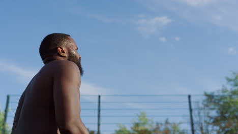 two international sportive players practicing street basketball outdoor