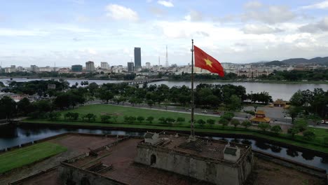 vietnamese flag waving proudly in the wind in the city of hué in the daylight