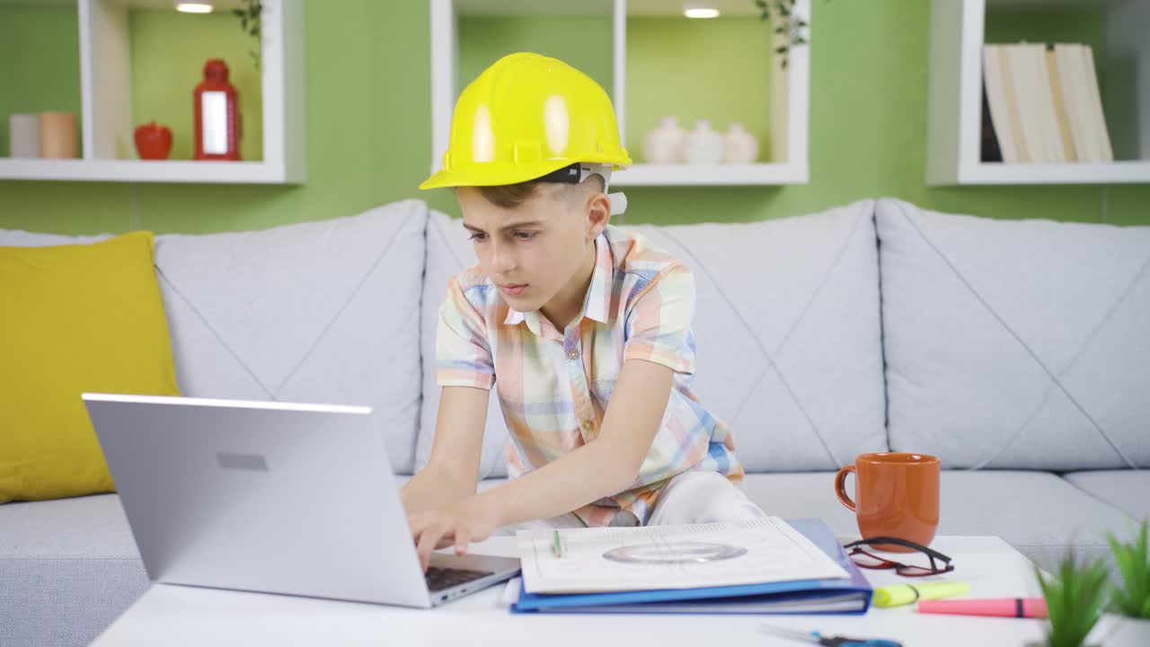 Curious boy tampering with his father's work laptop is doing wrong things.