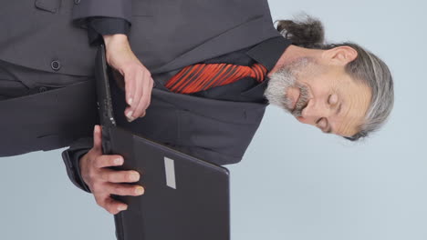 Vertical video of Tired old businessman.