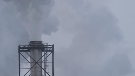 thick smoke from the chimney of a city heating facility