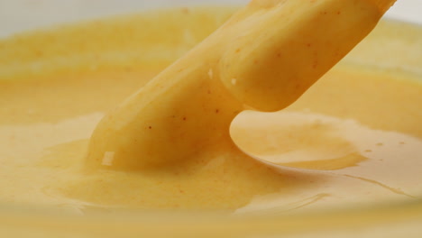 french fries dipping in a creamy sauce