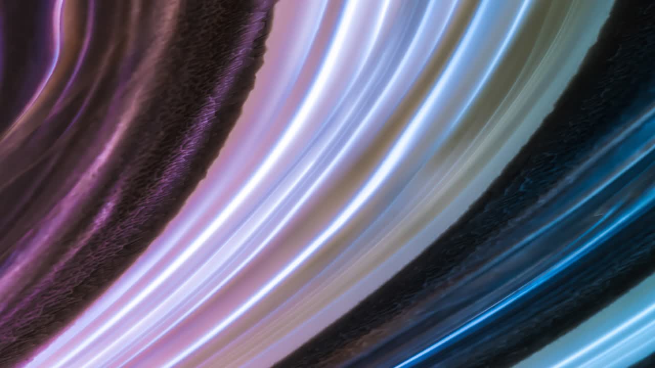 Bright futuristic abstract motion background with beautiful glowing neon colorful lines with gradient. Seamless looping. 4K video animation high quality.