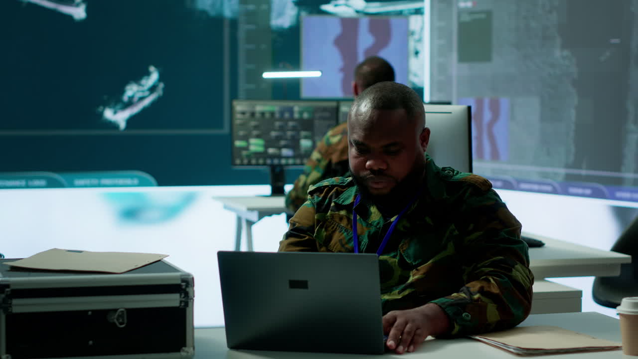 Military intelligence specialist uses high tech satellite systems and cctv radar