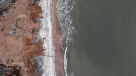 Aerial-shot-of-sandy-beach-in-Ustka-in-winter