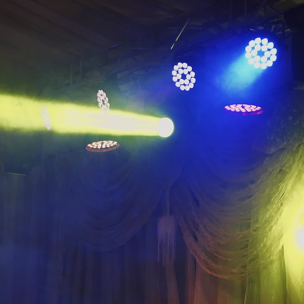 Disco light show. Stage color lights with laser. Lighting system for the dance floor in the nightclub.