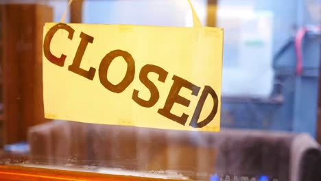 closed sign on a store window