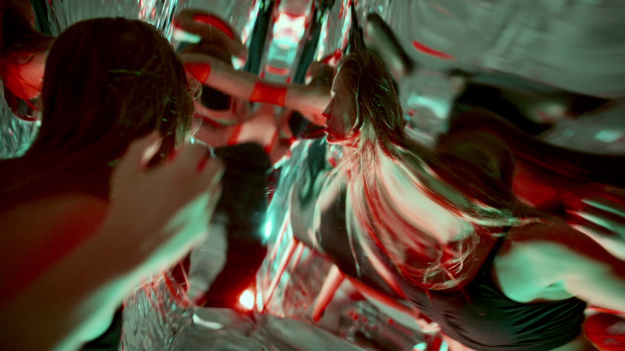 Mesmerized Woman Performing Dramatic Dance among Distorted Reflections
