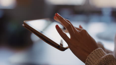 close up of womans hands using digital tablet computer technology