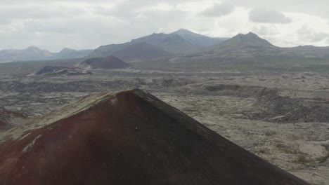 crater of kothraunskula volcano surrounded by moss-covered lava field in iceland