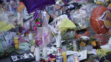 kobe gigi bryant memorial, balloons and other tribute items, slow motion