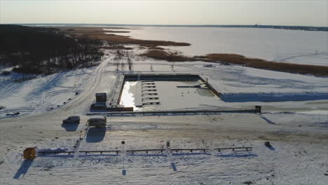 drone shot of ice roads in estonia during the winter snow with blue sky's