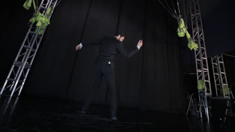 modern dance performance with suspended props