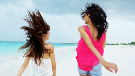 portrait of multi ethnic female on ocean beach