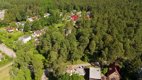 scenic tilt view of jurmala’s beach neighborhood nestled among lush green baltic forests