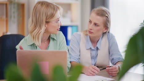 Serious-Women-Working-on-Project-in-Office