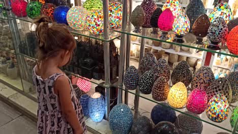 little girl in the souvenir market