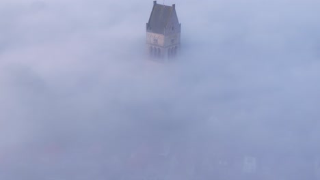 the martinikerk bolsward with magical morning fog, aerial