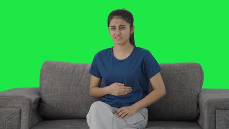 Indian-teenage-girl-suffering-from-stomach-pain-Green-screen