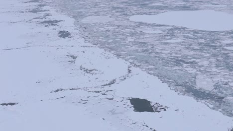 Aerial-Frozen-Knik-Arm-river-in-Alaska-USA-near-biggest-city-Anchorage