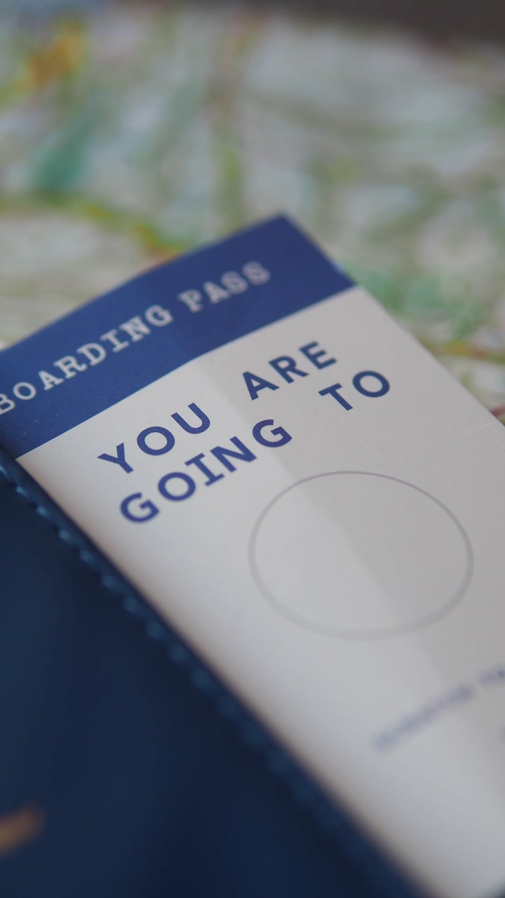 Close-up of a Boarding Pass and Passport for Travel