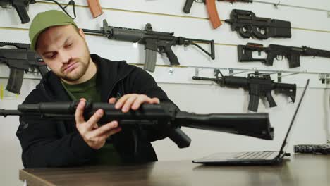 man behind a counter in an arms store 1